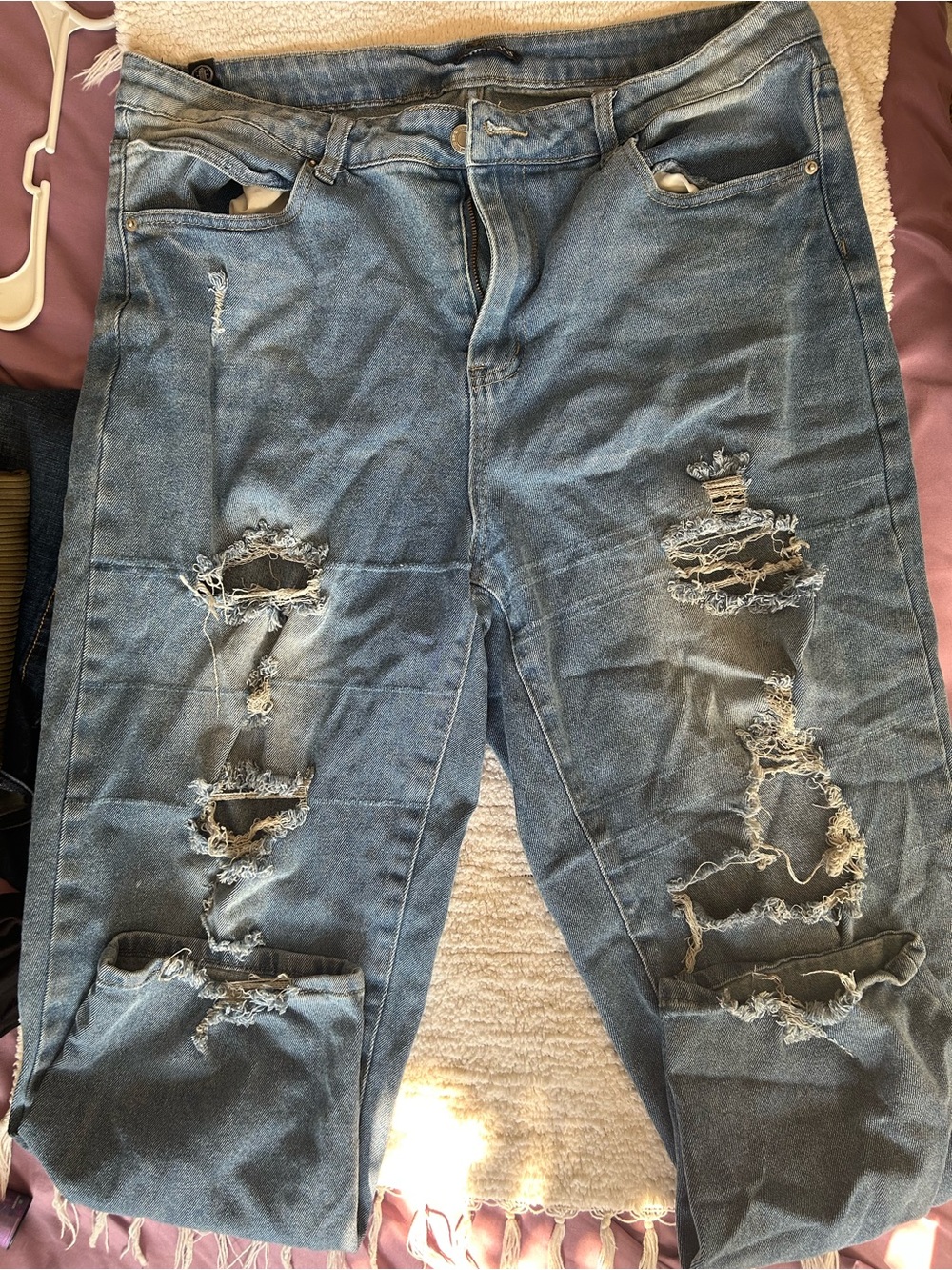 Elite brand ripped jeans